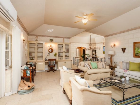 Spacious and elegant living room inside Mon Caprice, Sandy Lane, featuring luxurious decor and natural light in Barbados.