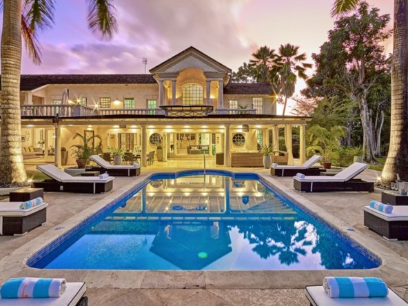 Exterior at twighlight of pool at Barbados luxury villa Sandy Lane Amberley House