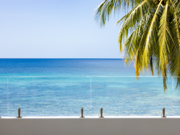 Barbados luxury modern beachfront villa view from master bedroom extensive terrace to the Caribbean Sea views beyond
