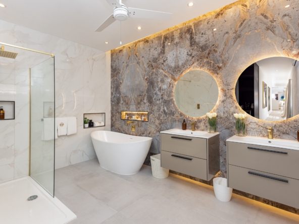 Barbados luxury modern beachfront villa master suite luxury bathroom with two sinks, shower and bath