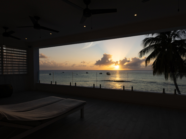 Barbados luxury modern beachfront villa balcony with Caribbean Sea sunset views