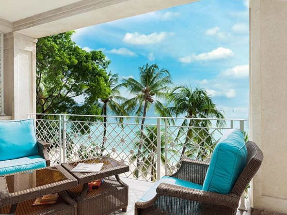Balcony and sea view at Smugglers Cove 6, a stunning 5-bedroom beachfront apartment on Paynes Bay.