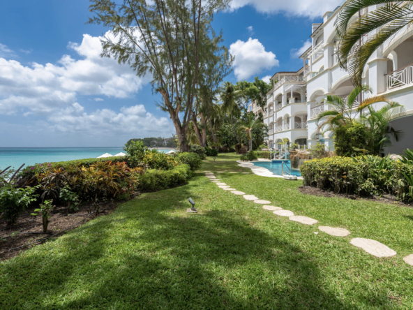 Green lawn and ocean view at Sundance at Old Trees, a beachfront vacation property in Barbados offering breathtaking Caribbean views.