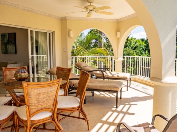 This luxury apartment showcases lush tropical gardens, brimming with vibrant foliage and exotic plants. Verdant leaves in various shades of green create a dense canopy, while colorful flowers add pops of color, creating a picturesque scene. The gardens are meticulously landscaped, with winding paths that invite you to explore further. Sunlight filters through the foliage, casting dappled shadows on the ground and highlighting the natural beauty of this serene oasis. This tranquil garden not only serves as a perfect retreat but also as a testament to the lush biodiversity of the Caribbean landscape.