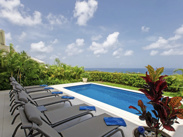 Pool, sunbeds and ocean view at Westmoreland Hill, Ohana
