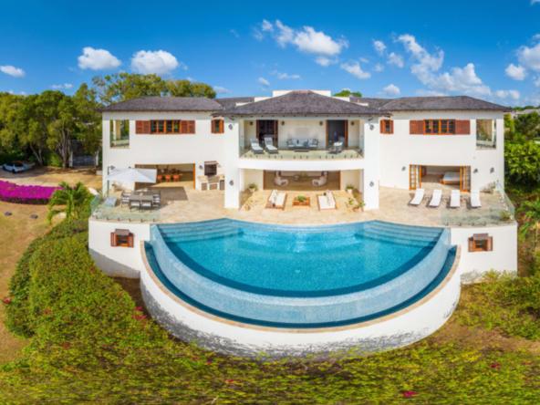 Exterior and pool at luxury rental villa in Barbados in the exclusive Sandy Lane Estate, offering panoramic sea views and modern, high-end finishes.