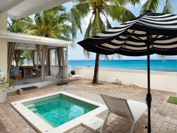 Pool, umbrella and beach access at beach house Barbados, Little Good Harbour Beach House, offering luxury living on the West Coast.