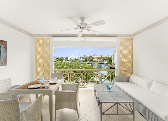 Contemporary living room and lagoon view at accessible 1 bedroom apartment, 247 Port St. Charles.