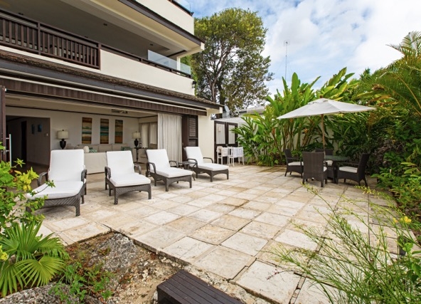The beachfront terrace at luxury apartment Coral Cove 1