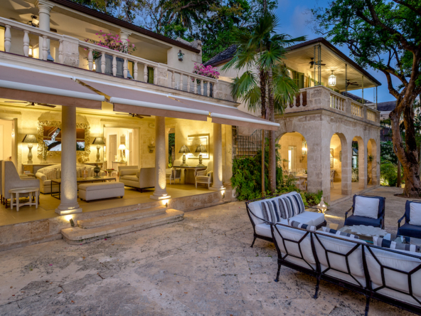 Maddox beachfront estate exterior lit at night