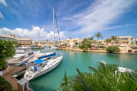 View of a boat from the Port St. Charles apartments