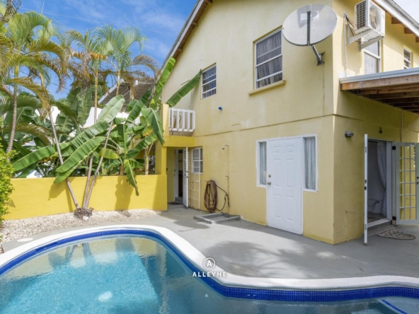 Charming income-generating property for sale in Speightstown, Barbados featuring two apartments, pool, and ocean views